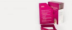 Bright pink display for medical information folders inviting patients to participate in a program