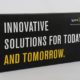 Black product introduction box for Sprint with white and yellow writing that says innovative solutions for today and tomorrow