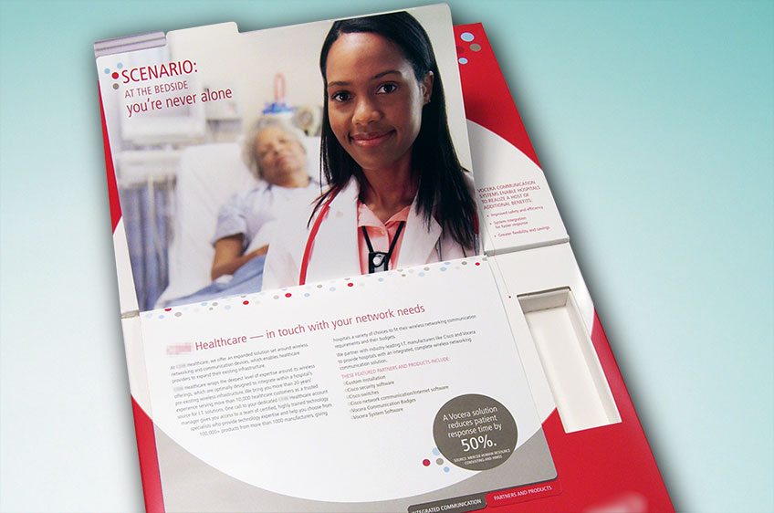 White and red direct mailer for healthcare information with a tabbed booklet insert and a picture on the top of a nurse with a patient in bed in the background