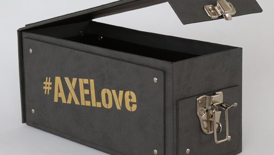 Black turned edge box with #AXELove on the side in gold lettering and the lid open with a silver clasp