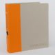 Close up of a grey and bright orange custom printed binder