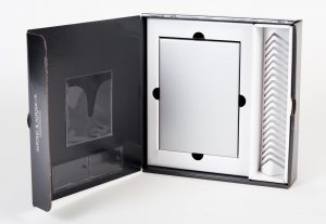 Direct mailer display opened up with plastic mini folders on the the left side and white box and organized space on the right side