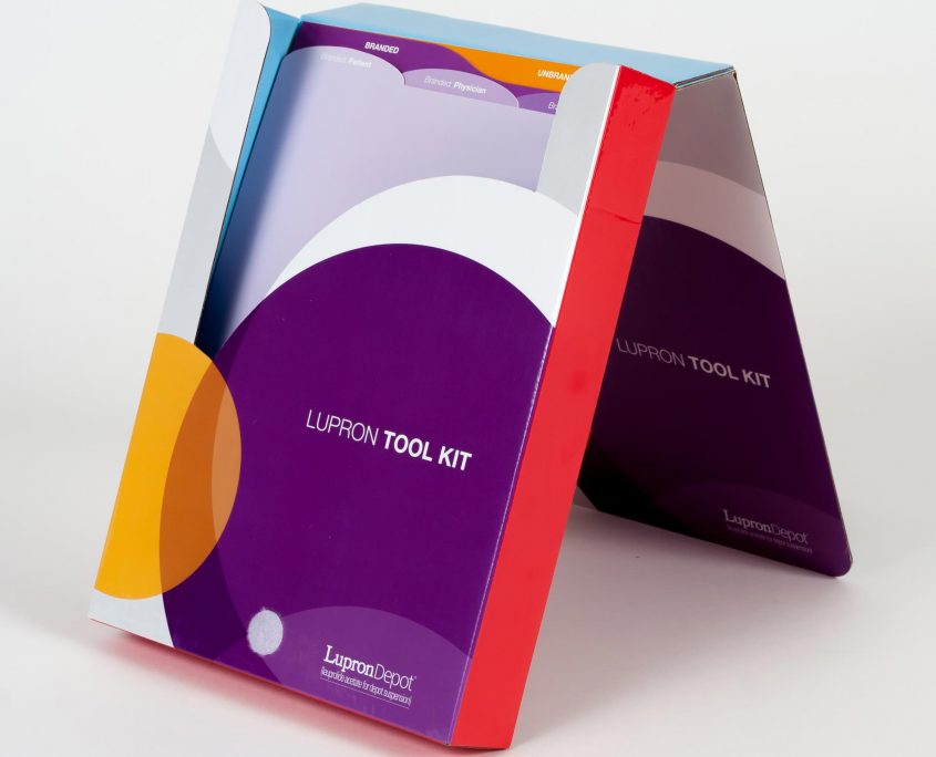 Custom product mailer with purple, orange and red colors and dividers with tabs on the inside