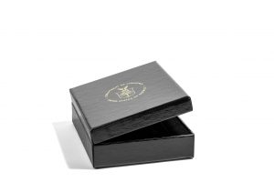 Half opened black custom cigar box with gold foil embossed logo on the top