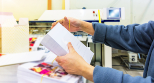 organizing envelopes to prepare for direct mail campaign